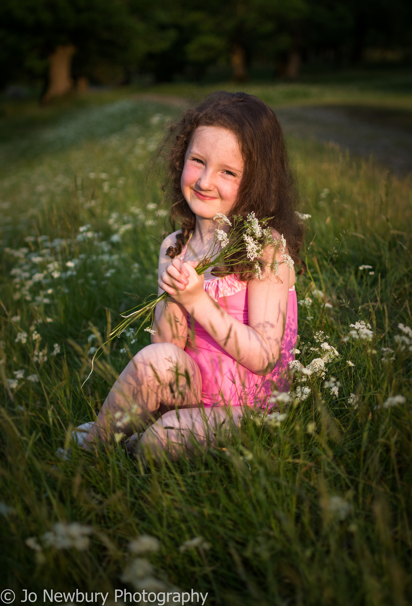 Jo Newbury Photography portrait lifestyle portrait child in grass