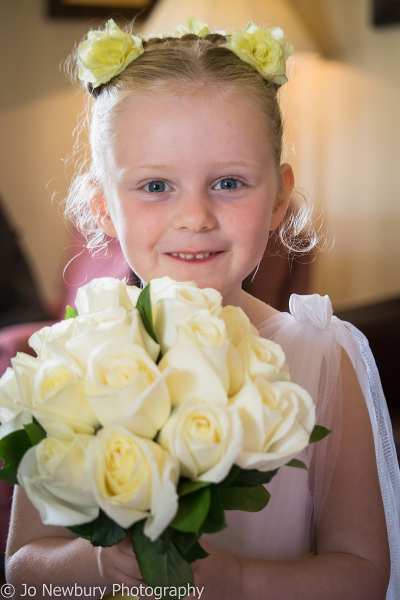 Jo Newbury Photography wedding bridesmaid with flowers