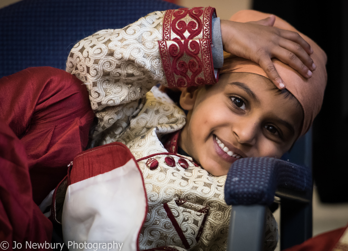 Jo Newbury Photography wedding Sikh boy resting